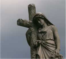 Oakland Cemetery in Warsaw Illinois - Statue with Cross